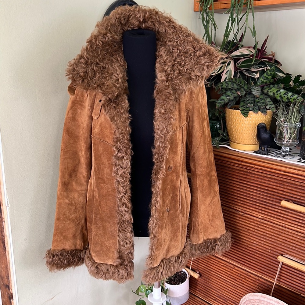 I love this piece so much!! Vintage express leather jacket with lamb fur trim!